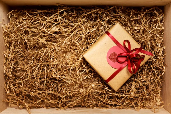 Wooden Box Present Wrapped Brown Craft Paper Red Ribbon Filled — Stock fotografie