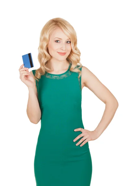 The beautiful blonde in a green dress holds a card — Stock Photo, Image