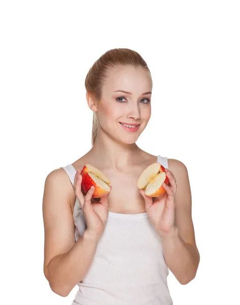 The beautiful girl the blonde holds halves of apples — Stock Photo, Image