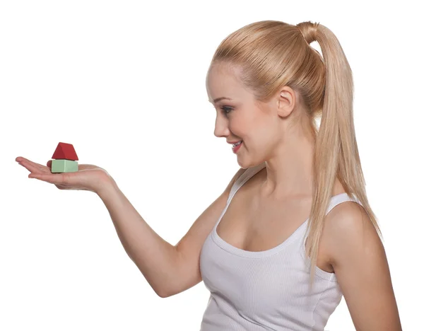 The beautiful girl the blonde with house model on a palm — Stock Photo, Image