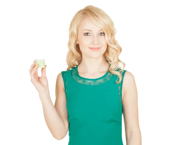 Beautiful blonde holds a cream jar in a hand — Stock Photo, Image