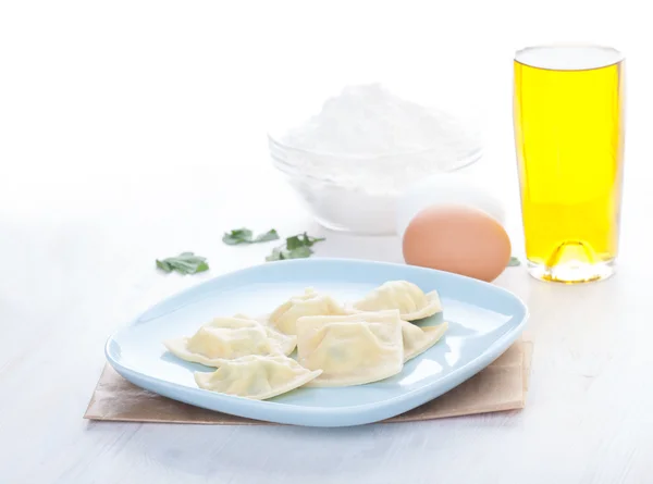 Homemade ravioli on a blue plate — Stock Photo, Image