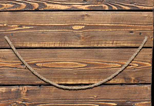 Background, rope on a wooden background, boards, texture — Stock Photo, Image