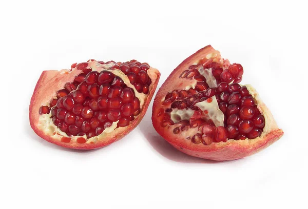 The broken pomegranate in a white background — Stock Photo, Image