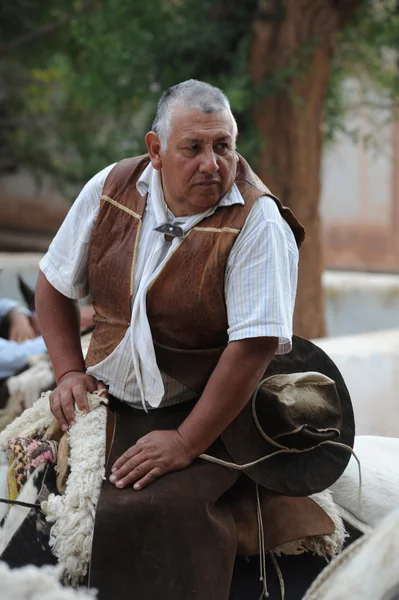 A man on horseback in traditional clothing — Stock Photo, Image