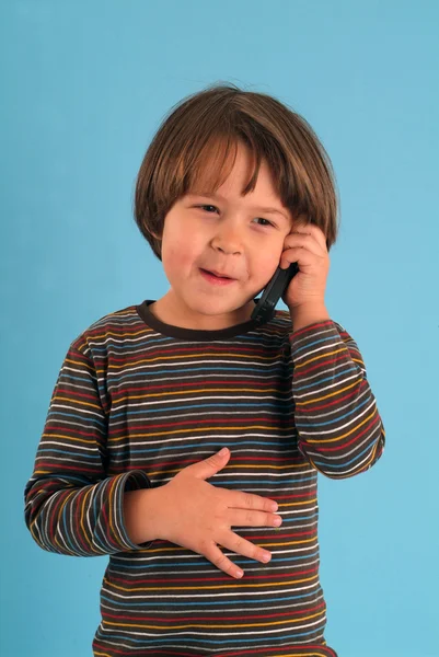 Child talking with a mobile phone — Stock Photo, Image