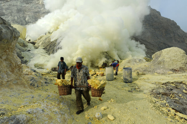 working on a sulfur nuggets atop a volcano in Indonesia