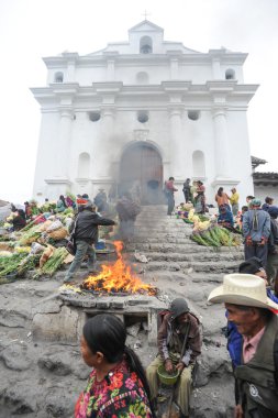 Indians in front of Santo Tomas church clipart