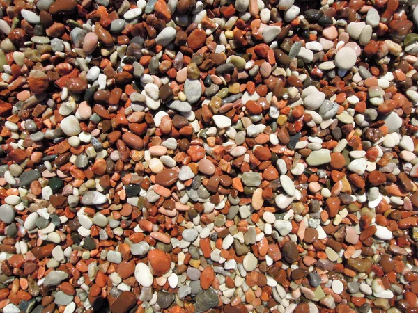 Stenar på en strand för bakgrund — Stockfoto