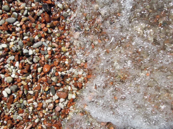 Stenar på en strand för bakgrund — Stockfoto