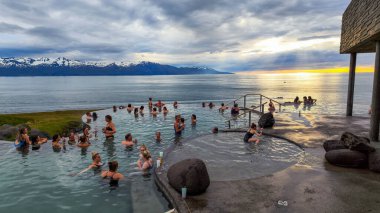 Husavik, Iceland- 13 July 2022: people on the wellness pool at Husavik on Iceland