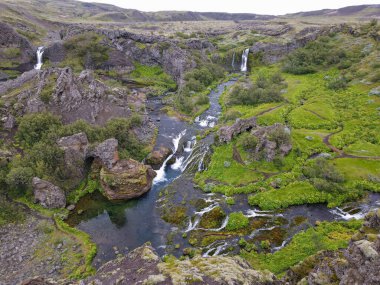 Drone view at the waterfalls of Gjain on Iceland
