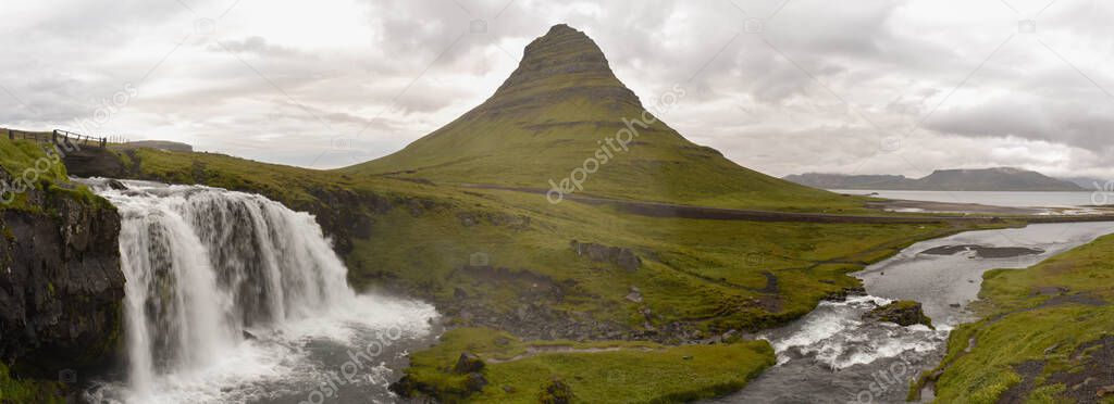 View at mount and waterfall of Kirkjufell at Grundarfjordur on Iceland