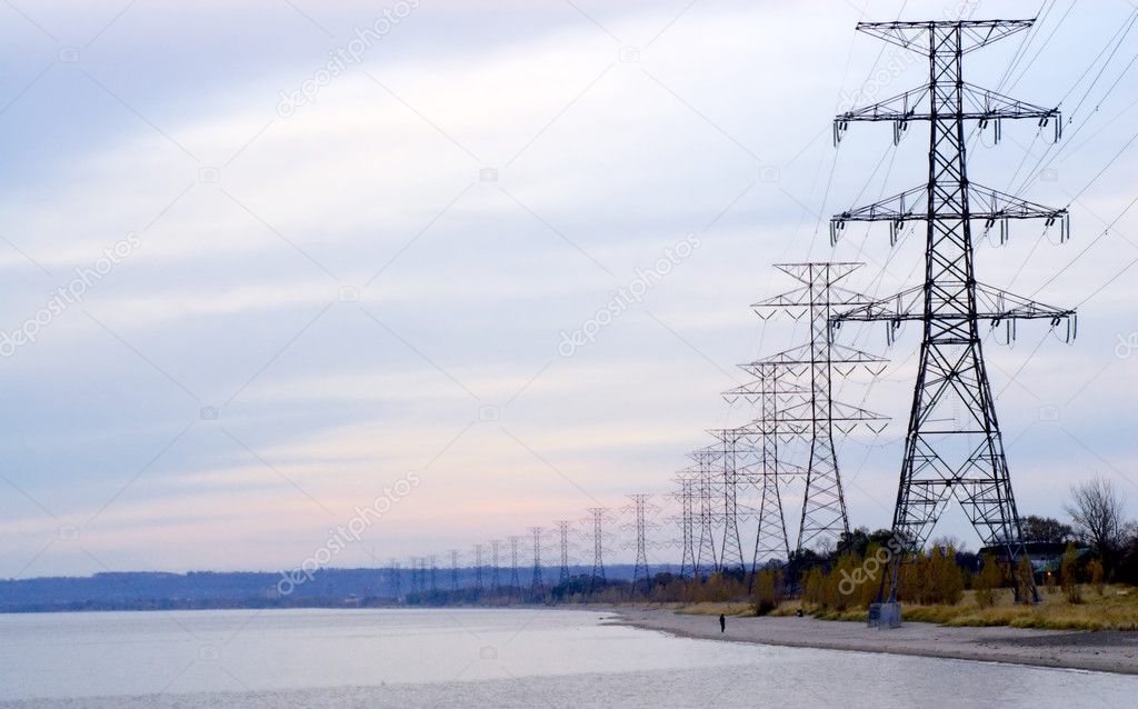 Row of electrical towers receding