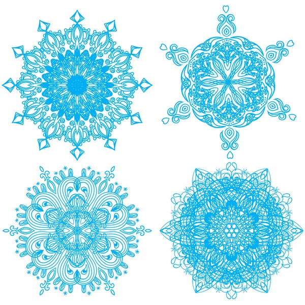 Samling av fyra elegans snöflingor — Stock vektor