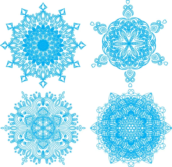 Kollektion von vier eleganten Schneeflocken — Stockvektor
