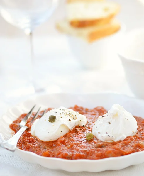 Poached egg with tomato souse — Stock Photo, Image