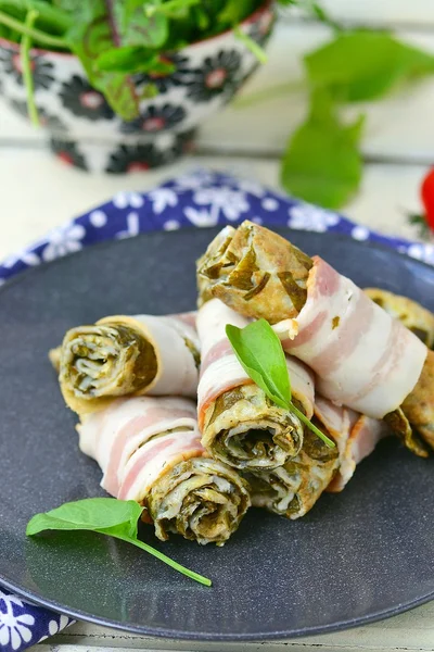 Rolls from an omelet with a sorrel and bacon — Stock Photo, Image