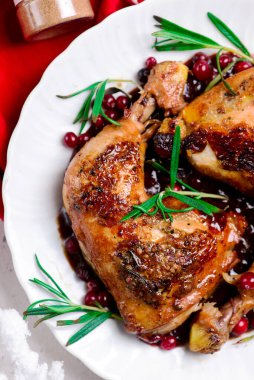 cranberry and rosemary roasted chiken.style rustic.selective focus
