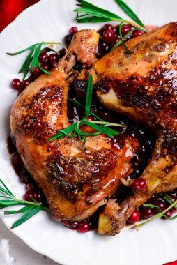 cranberry and rosemary roasted chiken.style rustic.selective focus