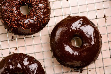 Chocolate baked donuts. top view..selective focus