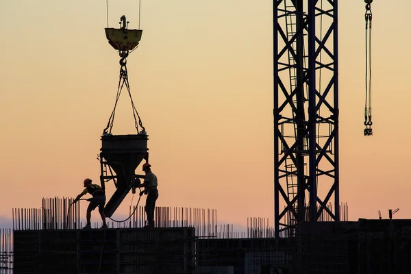 Pouring concrete into a newly built house — Stock Photo, Image