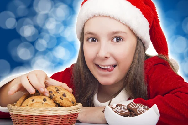 Happy Christmas girl wants to eat cookie — Stock Photo, Image