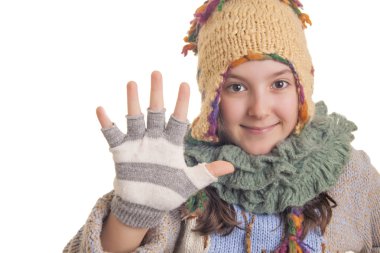 Beautiful young girl in warm winter clothes showing five clipart