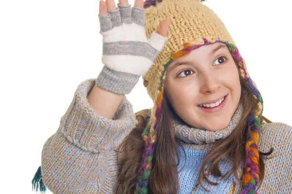 Beautiful young girl in warm winter clothes smiles and waving — Stock Photo, Image
