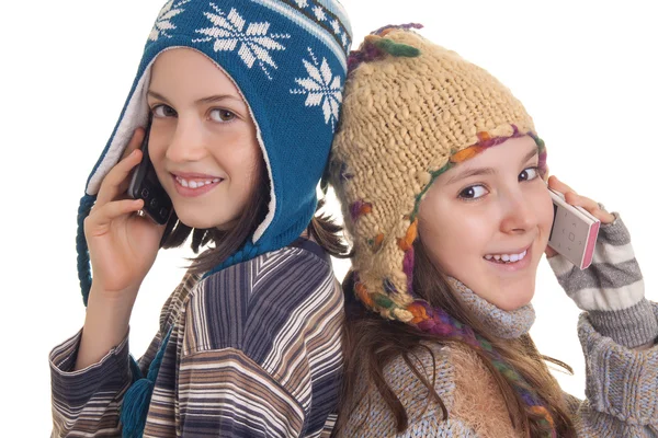 Beautiful young girls in warm winter clothes speaking on a mobil — Stock Photo, Image