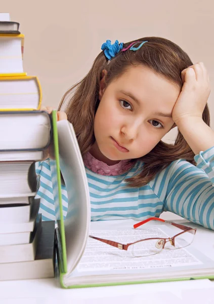 Beautiful girl having a lot of homework — Stock Photo, Image