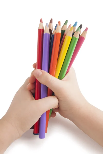 Color pencils in child hands — Stock Photo, Image