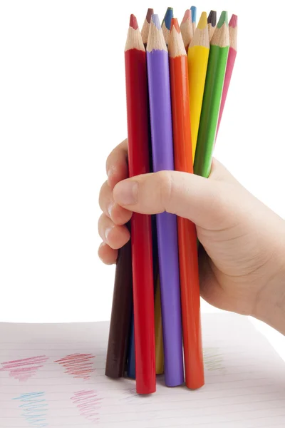 Kleur potloden in kind hand — Stockfoto