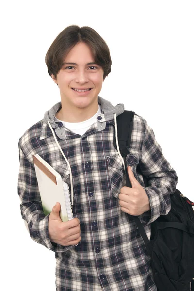 Knappe lachende tiener met tas inpakken en boeken — Stockfoto