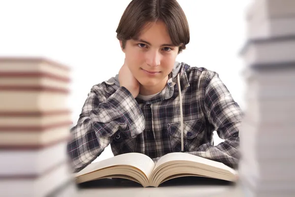 Teen boy learning at the desk — Stock Photo, Image