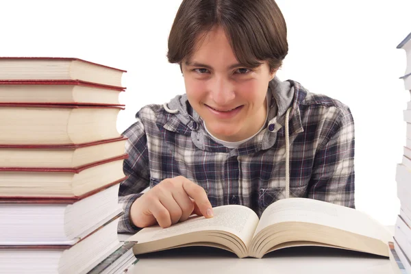 Teen boy learning at the desk — Stock Photo, Image