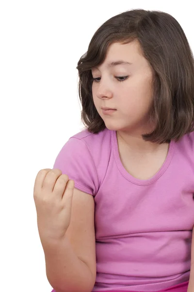 Adolescente menina olhando suas unhas — Fotografia de Stock