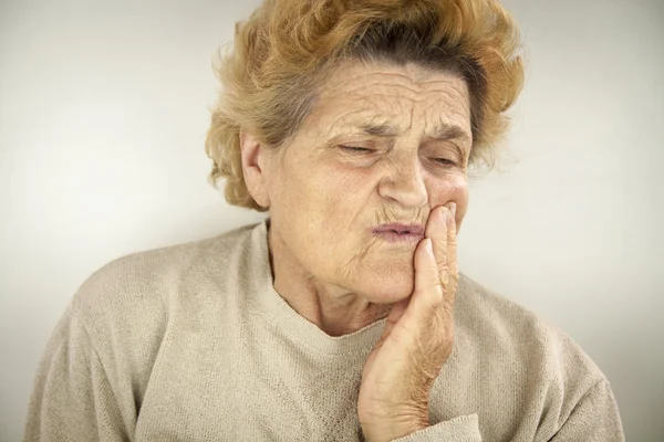 Senior woman having teeth ache — Stock Photo, Image