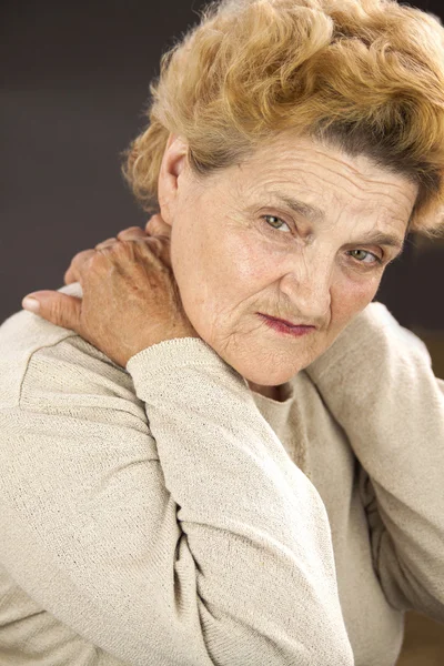 Senior woman having neck ache — Stock Photo, Image