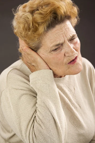Senior woman having ear pain — Stock Photo, Image