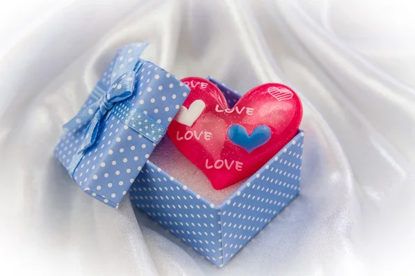 Red love heart in a little blue gift box — Stock Photo, Image