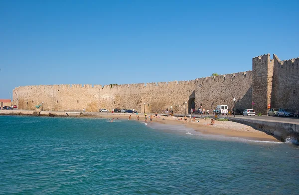 Mandraki harbor and a beach, Rhodes, Greece. — Stock Photo, Image