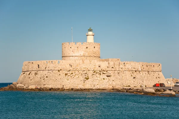 The old fortress and the lighthouse on Rhodes island, Greece. — Stock Photo, Image