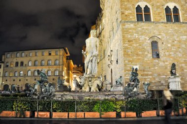 FLORENCE-NOVEMBER 11:Fountain of Neptune on Piazza della Signoria at night on November 11,2010 in Florence,Italy. The Fountain of Neptune is a fountain in Florence, Italy, next to the Palazzo Vecchio. clipart