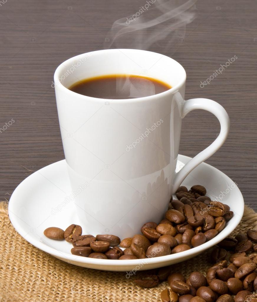 Cup of hot drink with coffee beam