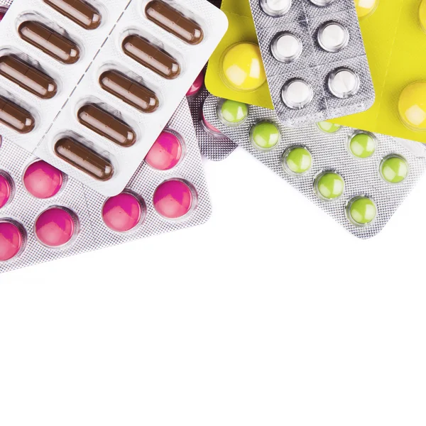 Kolorowe tabletki, tabletki i kapsułki na białym tle — Zdjęcie stockowe