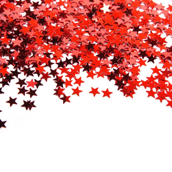 Червоні зірки конфетті ізольовані на білому тлі — стокове фото
