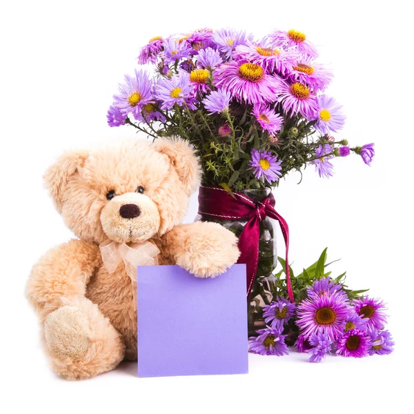 Teddybär und Blumen — Stockfoto