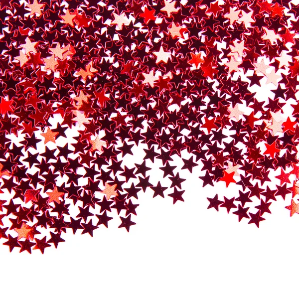 Beyaz arka plan üzerinde izole kırmızı yıldızlar konfeti — Stok fotoğraf