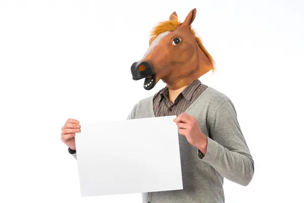 Man-horse on an office chair reading a newspaper — Stock Photo, Image